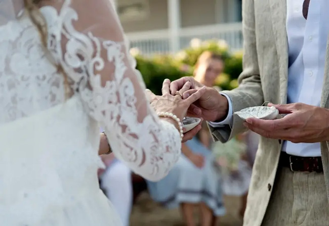 A man and woman exchanging wedding rings in Tucson, AZ